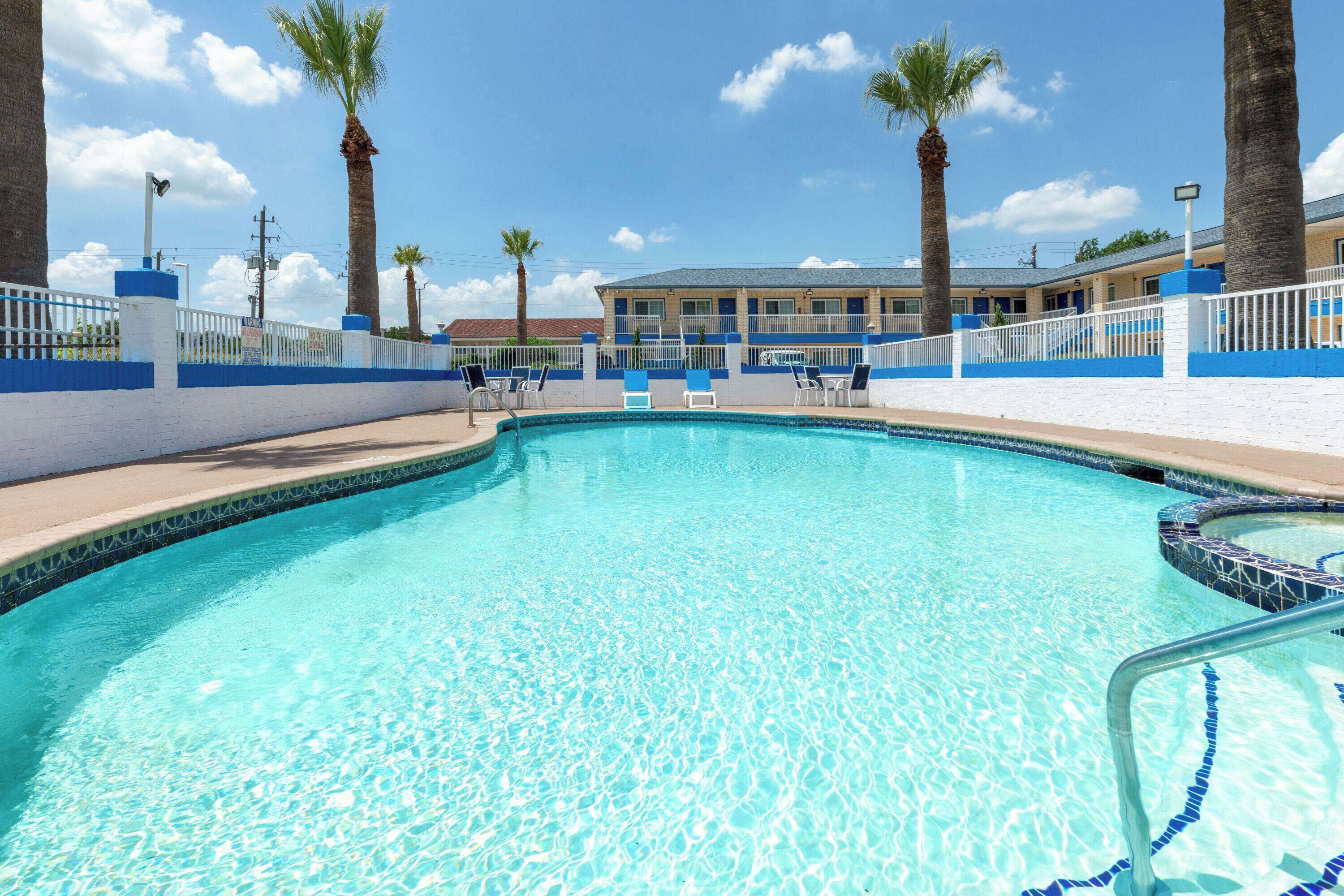 Outdoor pool, open 8 AM to 9 PM, pool umbrellas, sun loungers
