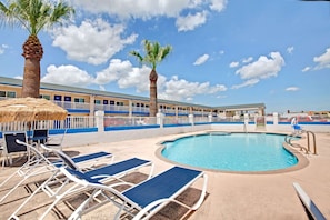 Outdoor pool, open 8 AM to 9 PM, pool umbrellas, sun loungers