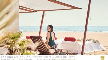 Relax in style with a first-row cabana, perfect for taking in the ocean views.
