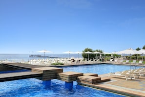 Indoor pool, seasonal outdoor pool, pool umbrellas, pool loungers