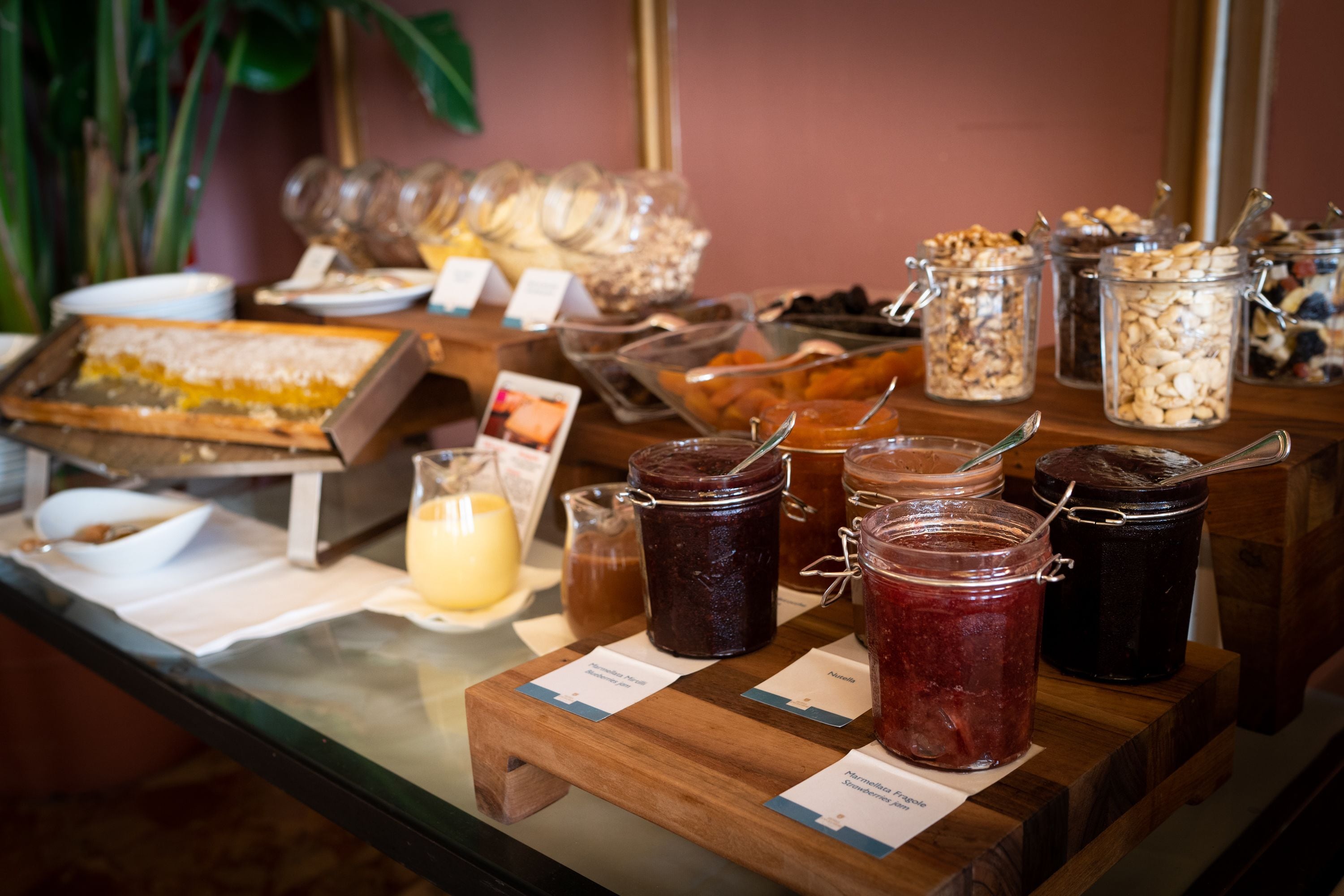 A buffet with various food items and condiments.