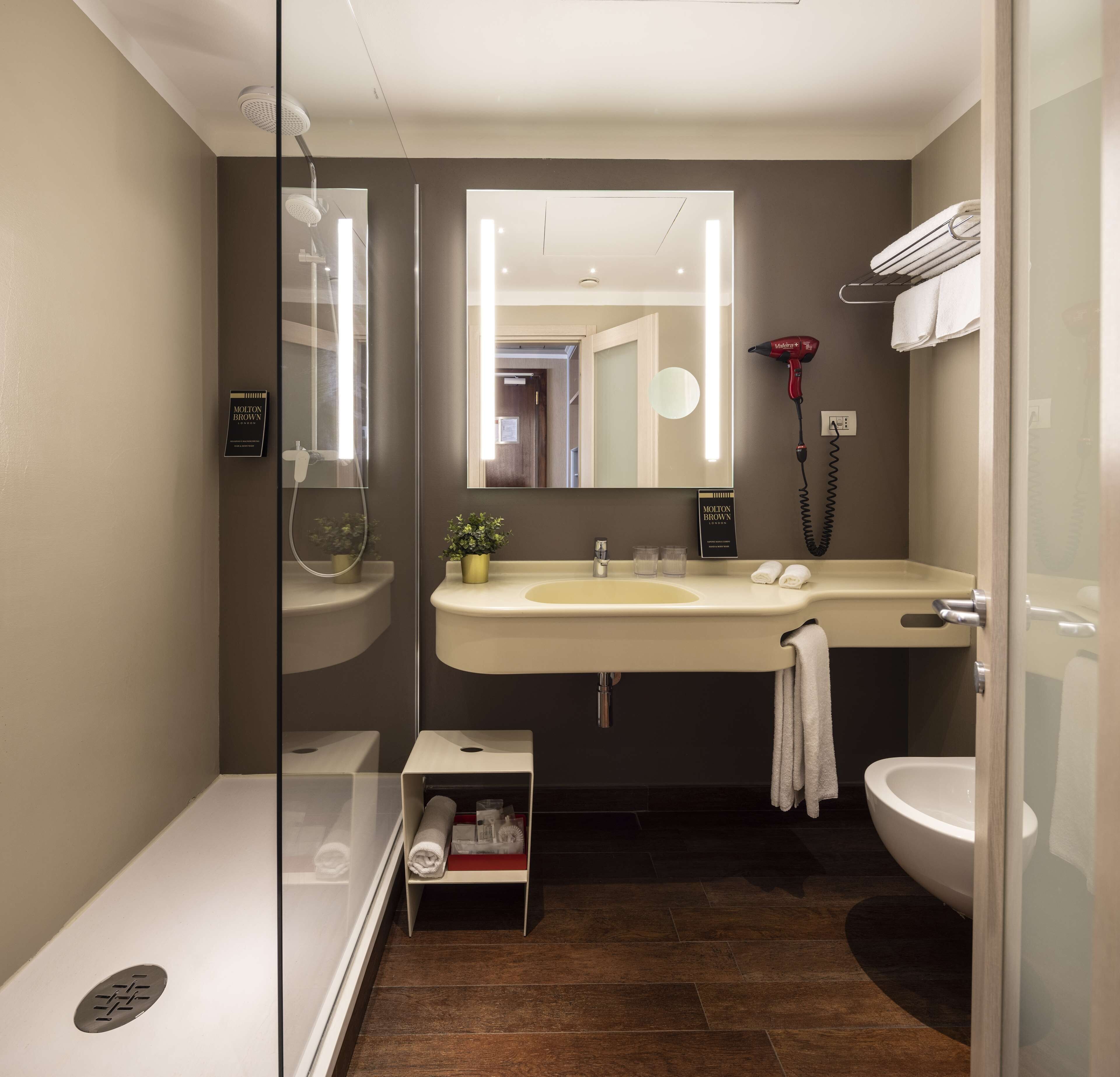 hydromassage showerhead, free toiletries, hair dryer, slippers