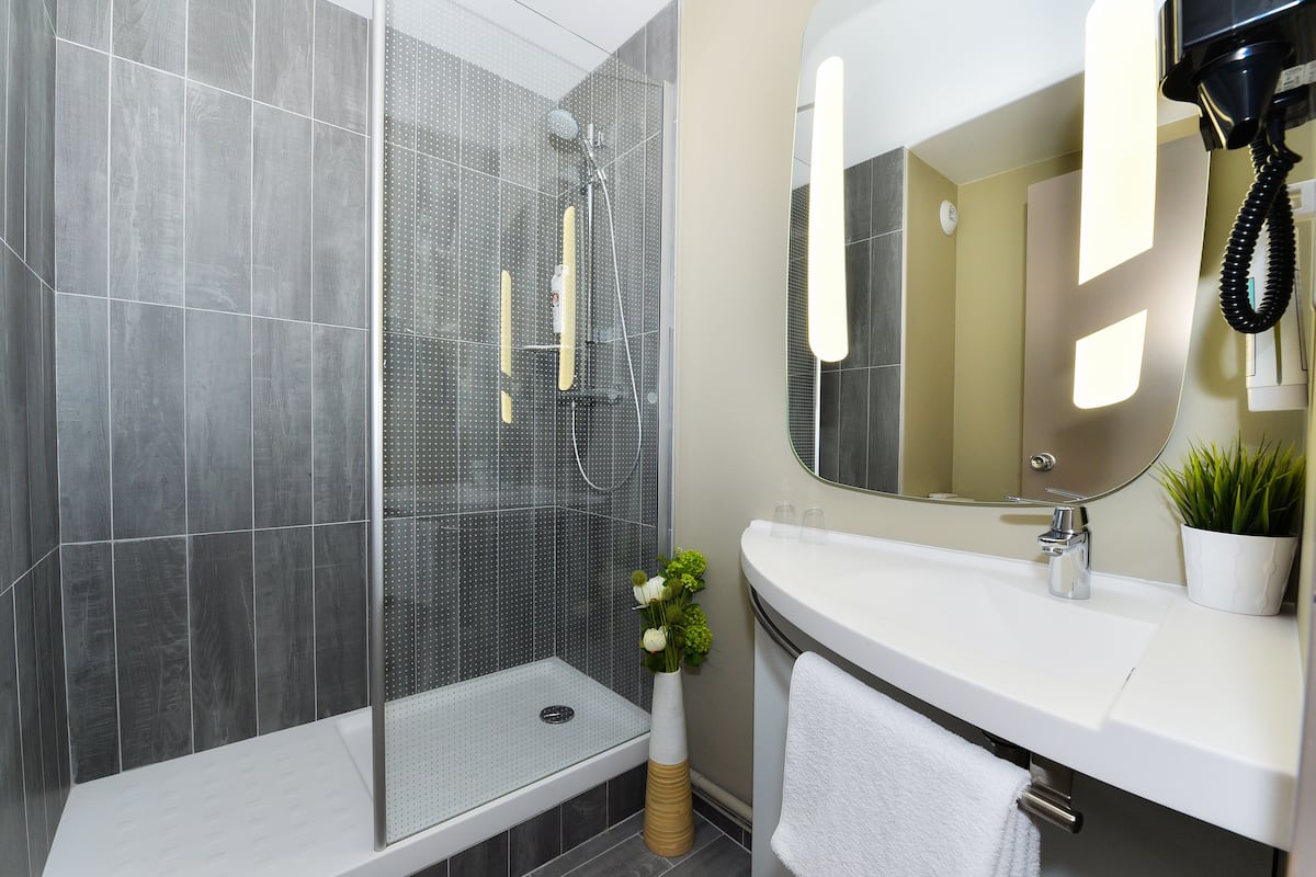 shower, eco-friendly toiletries, hair dryer, towels