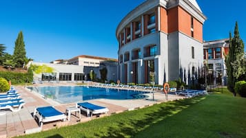 Seasonal outdoor pool, pool umbrellas, pool loungers