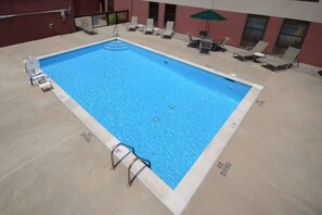 Seasonal outdoor pool, pool loungers