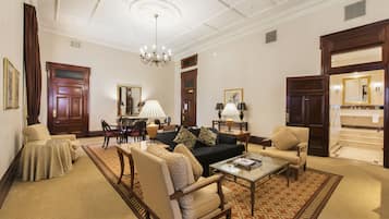 Suite, 1 King Bed | Living area | 55-inch LCD TV with cable channels, TV, pay movies