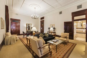 Suite, 1 King Bed | Living area | 55-inch LCD TV with cable channels, TV, pay movies