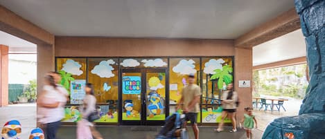 A children's club entrance with a play area and a nursing room.