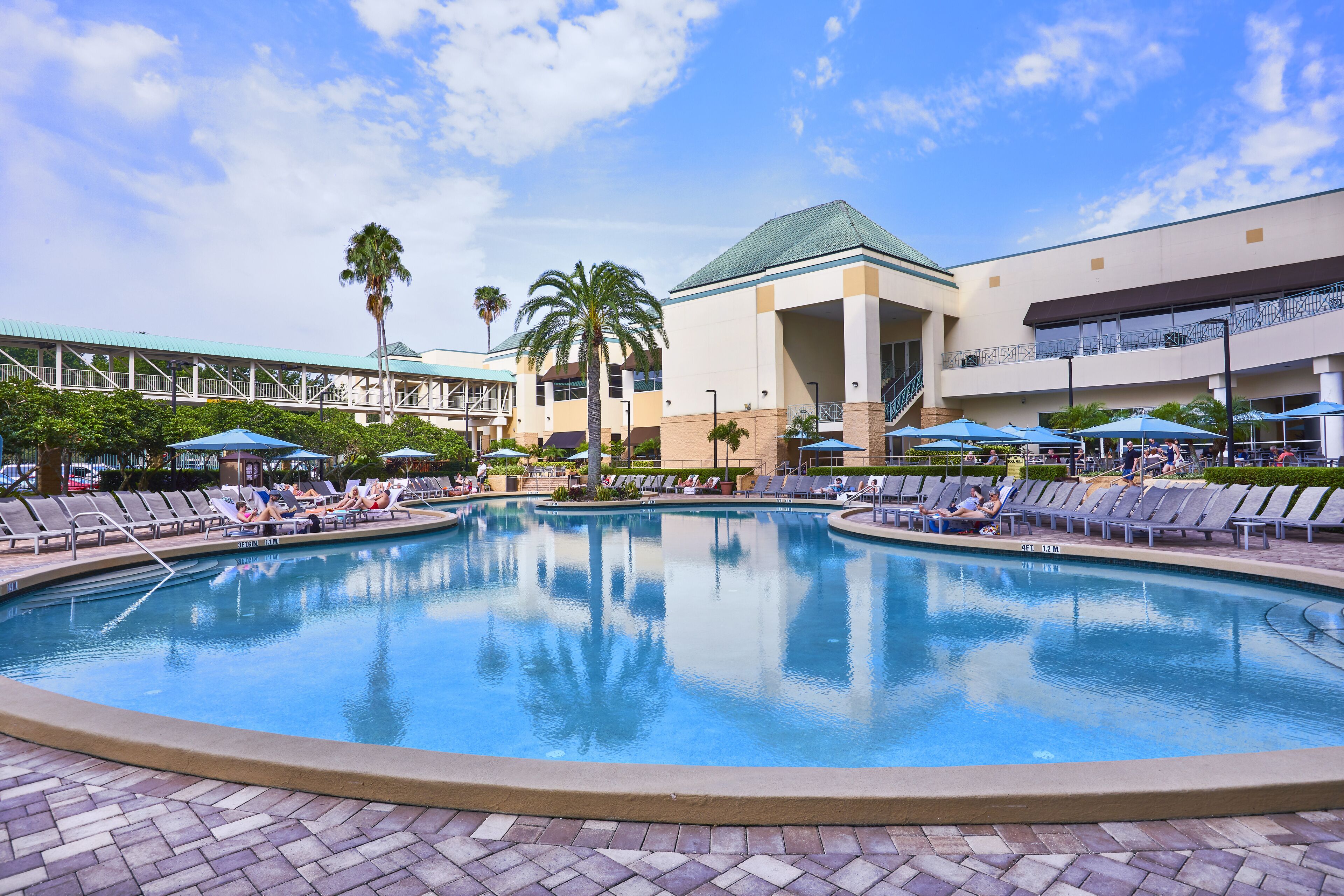 outdoor pool, open 8:00 am to midnight, pool umbrellas, pool loungers