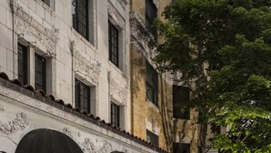 The Willows Hotel with a classical facade, arched windows, and a signboard. - The Willows Hotel (Chicago)