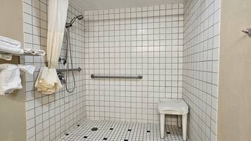 Room, 1 King Bed, Roll-in Shower | Bathroom | Combined shower/tub, jetted tub, free toiletries, hair dryer