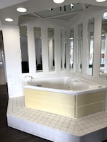 Room, 1 King Bed, Jetted Tub | Desk, blackout drapes, iron/ironing board, free WiFi
