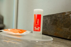 Standard Room, 1 King Bed, Smoking | Bathroom amenities | Combined shower/tub, free toiletries, hair dryer, towels