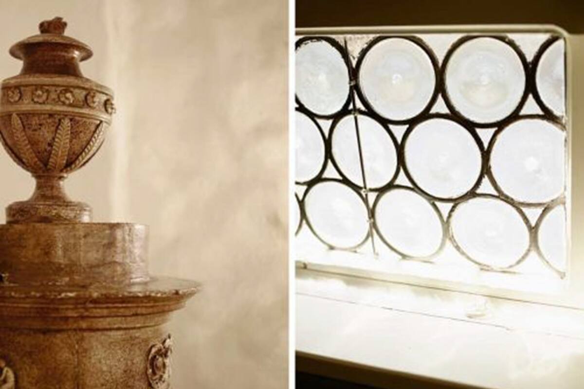 A decorative urn and a window with circular glass panes.