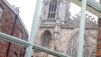 A historic building with Gothic architecture, including pointed arches and detailed stonework.