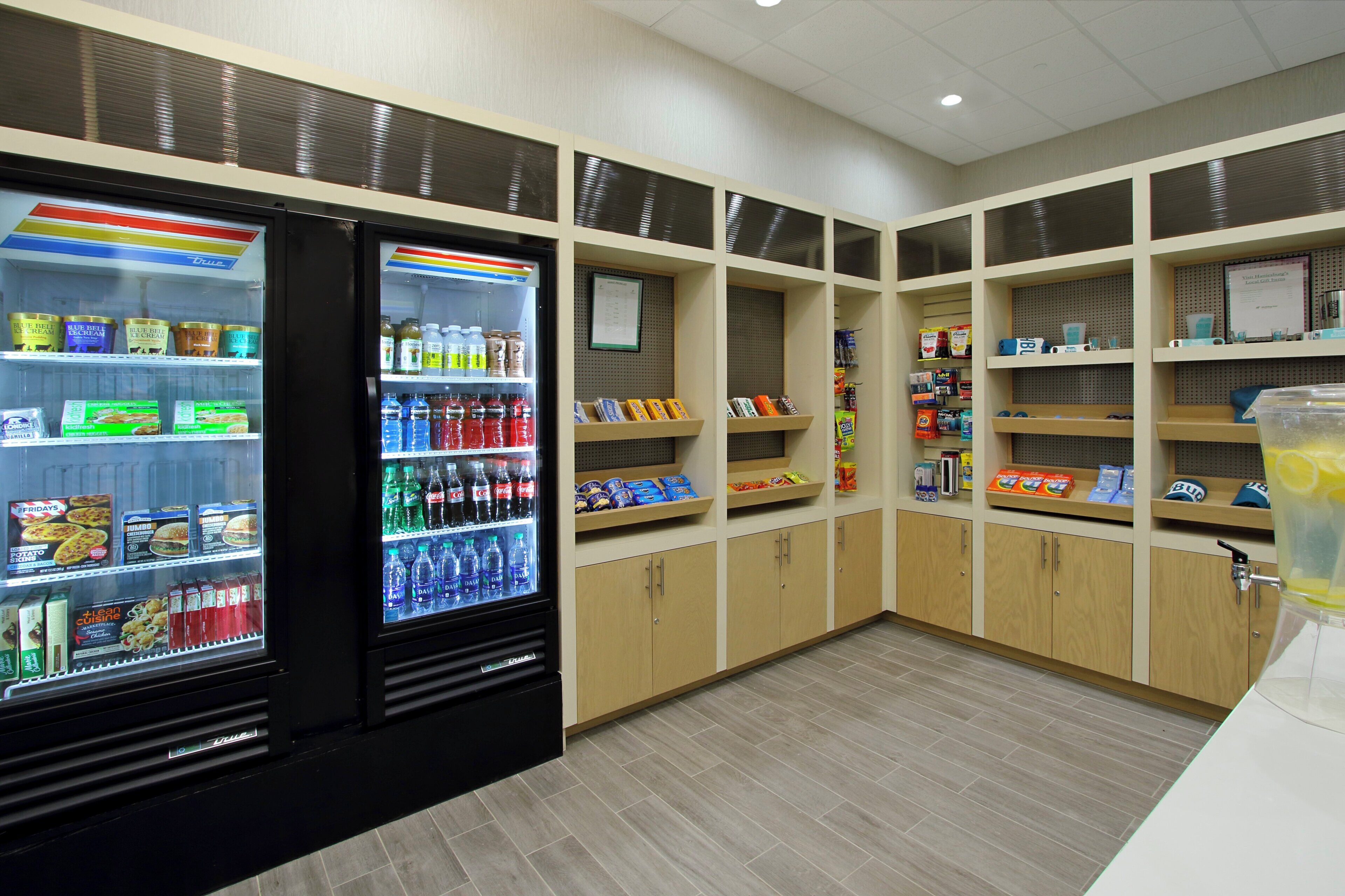 A clean, well-organized snack and drink vending area with various options including beverages, snacks, and ice cream.
