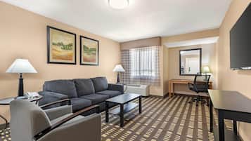 Suite, 1 King Bed, Non Smoking | Desk, laptop workspace, blackout drapes, iron/ironing board