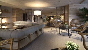 A modern living room with a sofa, chairs, a coffee table, and a lamp. - Hotel Zenit Sevilla (Seville)