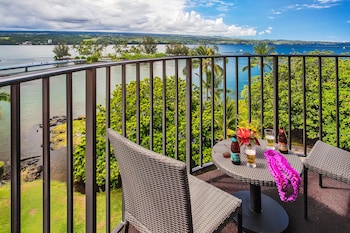 Hotel room view looking out at Hilo Hawaiian Hotel, Trademark Collection by Wyndham