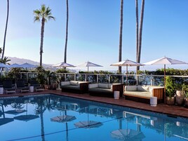 Outdoor pool, free cabanas, pool umbrellas