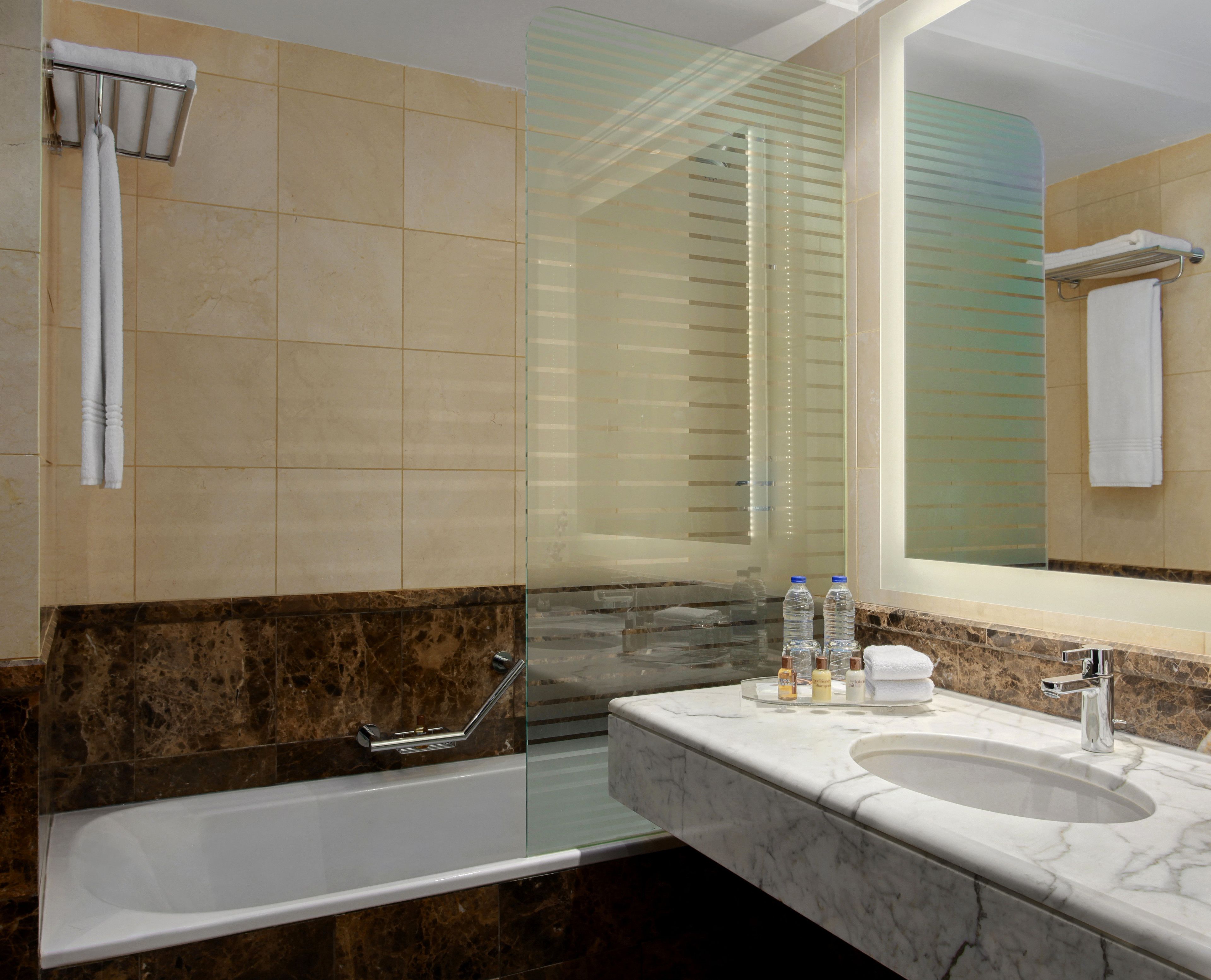 combined shower/bathtub, designer toiletries, hair dryer, bathrobes