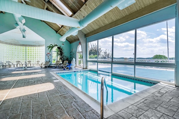 Indoor pool, outdoor pool, open 9 AM to 11 PM, pool loungers