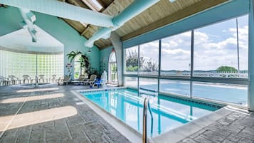 Indoor pool, outdoor pool, open 9 AM to 11 PM, pool loungers