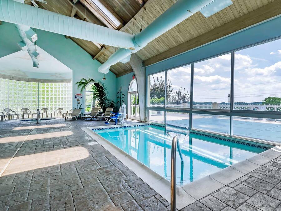 Indoor pool, outdoor pool, open 9 AM to 11 PM, pool loungers