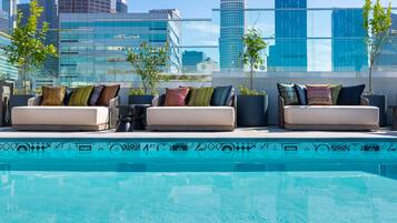 Outdoor pool, open 6:00 AM to 8:00 PM, free cabanas, pool umbrellas