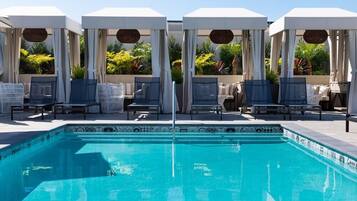 Outdoor pool, open 6:00 AM to 8:00 PM, free cabanas, pool umbrellas