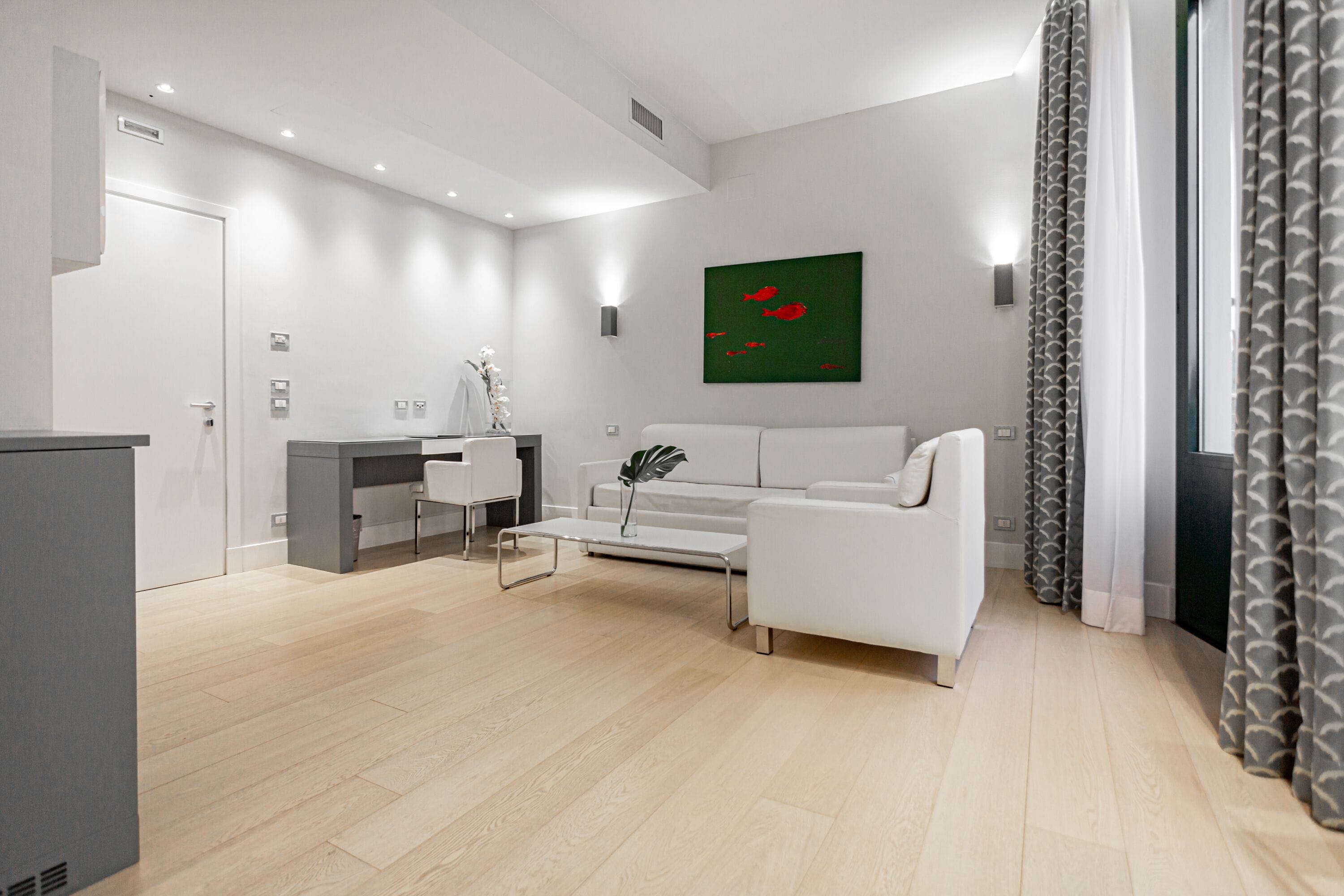 junior suite | living area | flat-screen tv