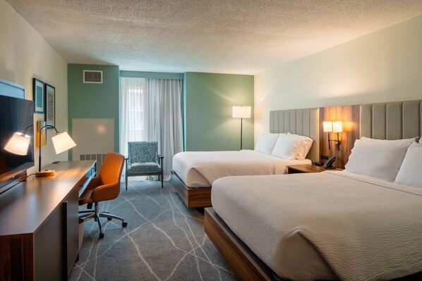 A hotel room with two beds, a desk, a chair, and a TV. -  Holiday Inn Express & Suites Charleston DWTN - Medical CTR by IHG (Charleston)