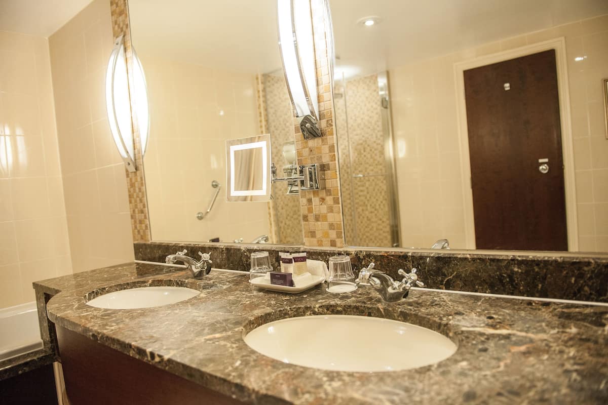 junior suite | bathroom | eco-friendly toiletries, hair dryer, bathrobes, slippers