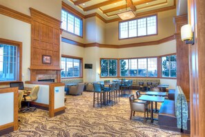 A spacious room with high ceilings, large windows, and a patterned carpet. - Holiday Inn Express Spokane Downtown by IHG (Spokane)