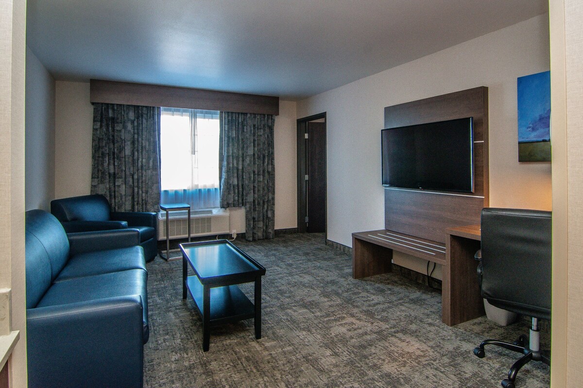 Suite, 2 Queen Beds | Desk, laptop workspace, blackout drapes, iron/ironing board