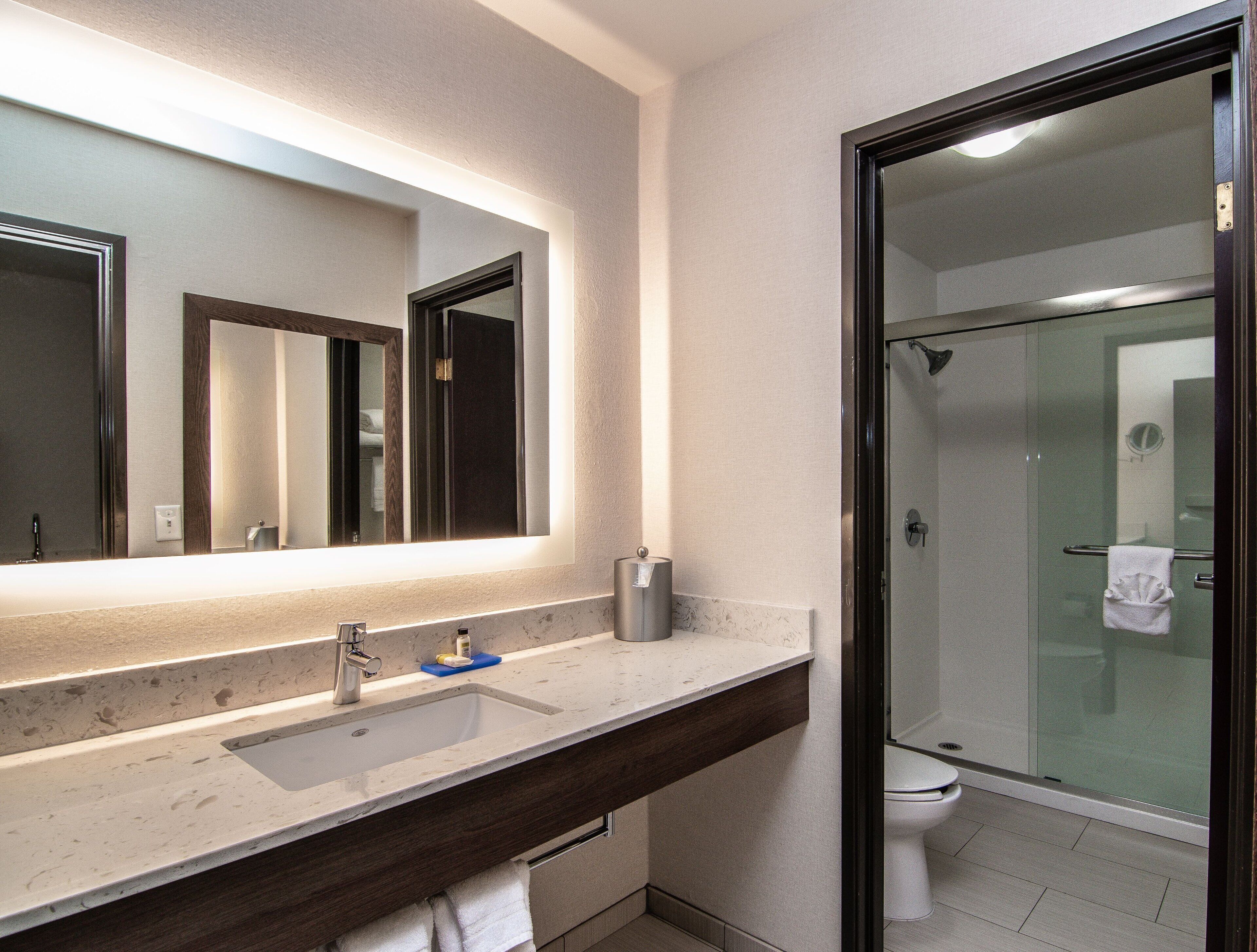 suite, 1 king bed, balcony, city view | bathroom | eco-friendly toiletries, hair dryer, towels, soap