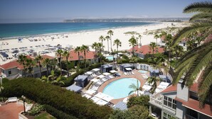 A resort with a swimming pool, beach, and palm trees. - Hotel del Coronado, Curio Collection by Hilton (Coronado)