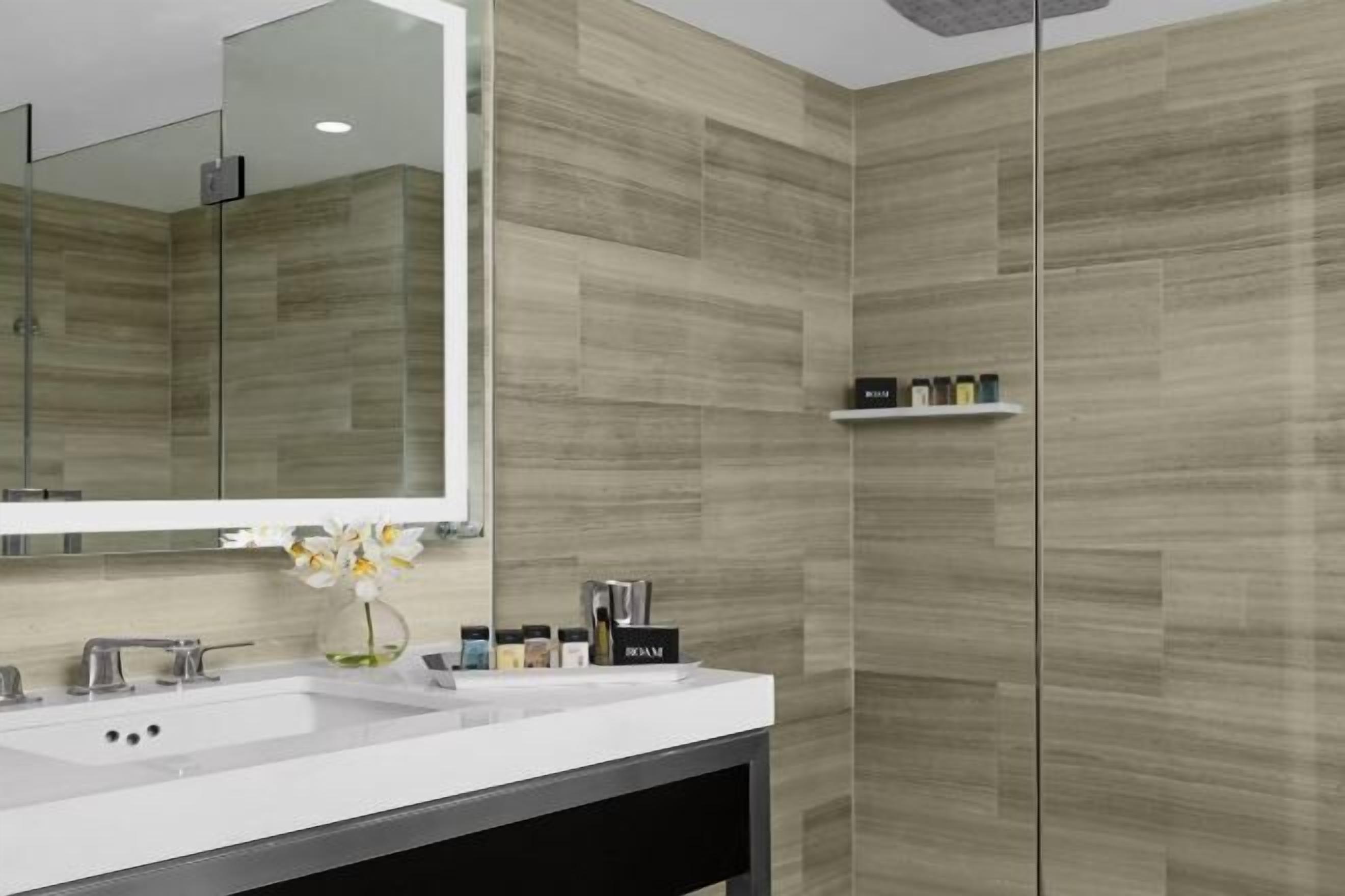 Designer toiletries, hair dryer, towels