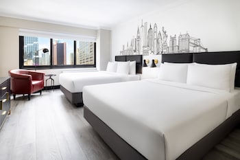 Premium bedding, pillowtop beds, in-room safe, desk at The Manhattan at Times Square Hotel, an IHG Hotel