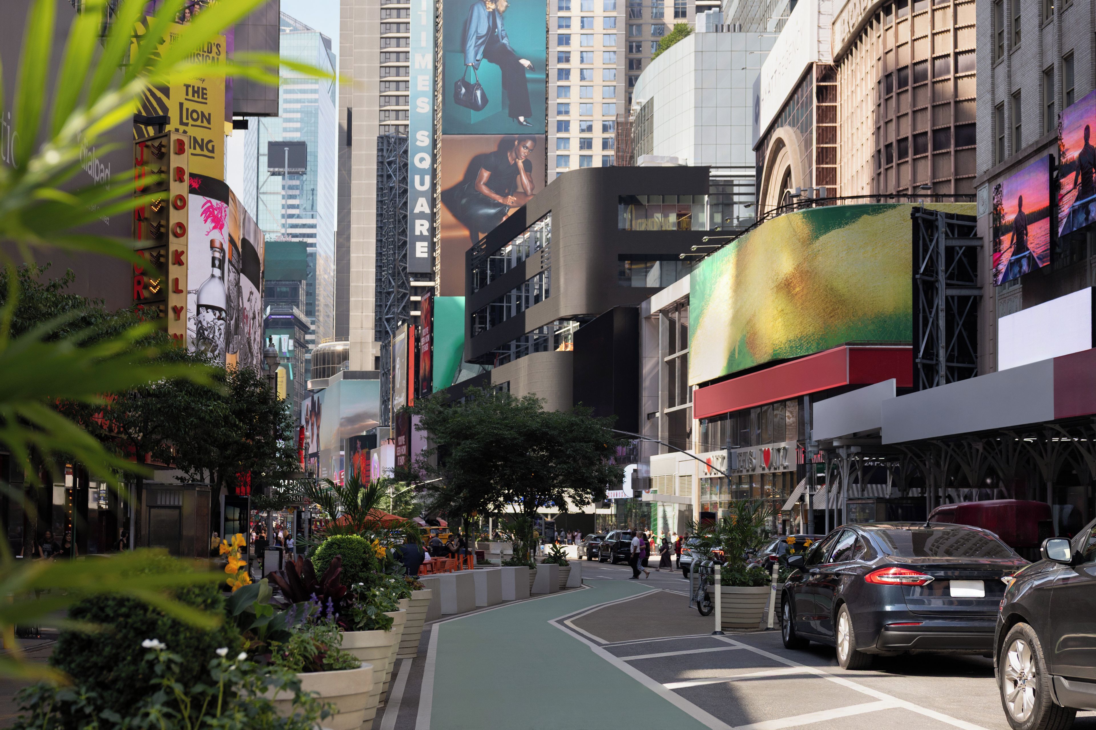 A city street with buildings, a bike lane, and cars.
