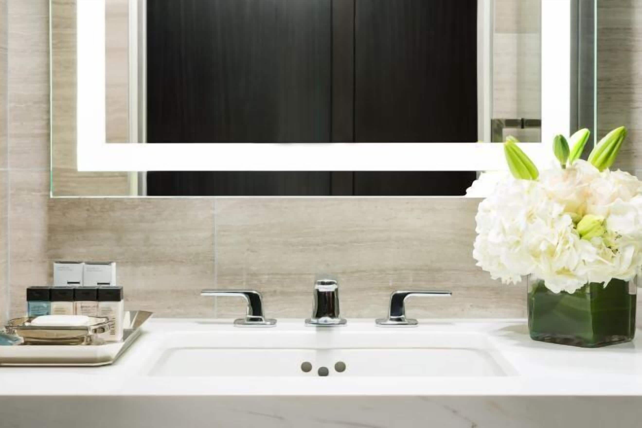 Designer toiletries, hair dryer, towels