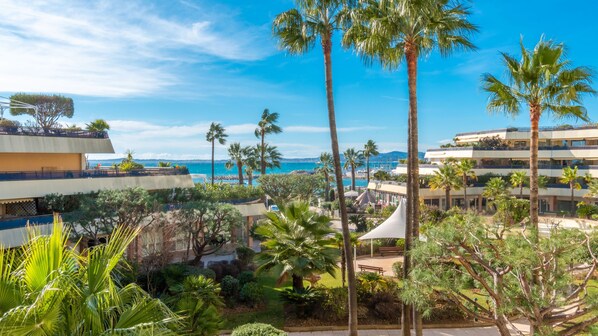 Escape to a serene tropical oasis with lush gardens and breathtaking views of the surrounding landscape.