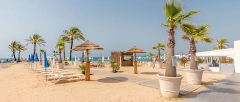 Private beach, white sand, sun-loungers, beach umbrellas