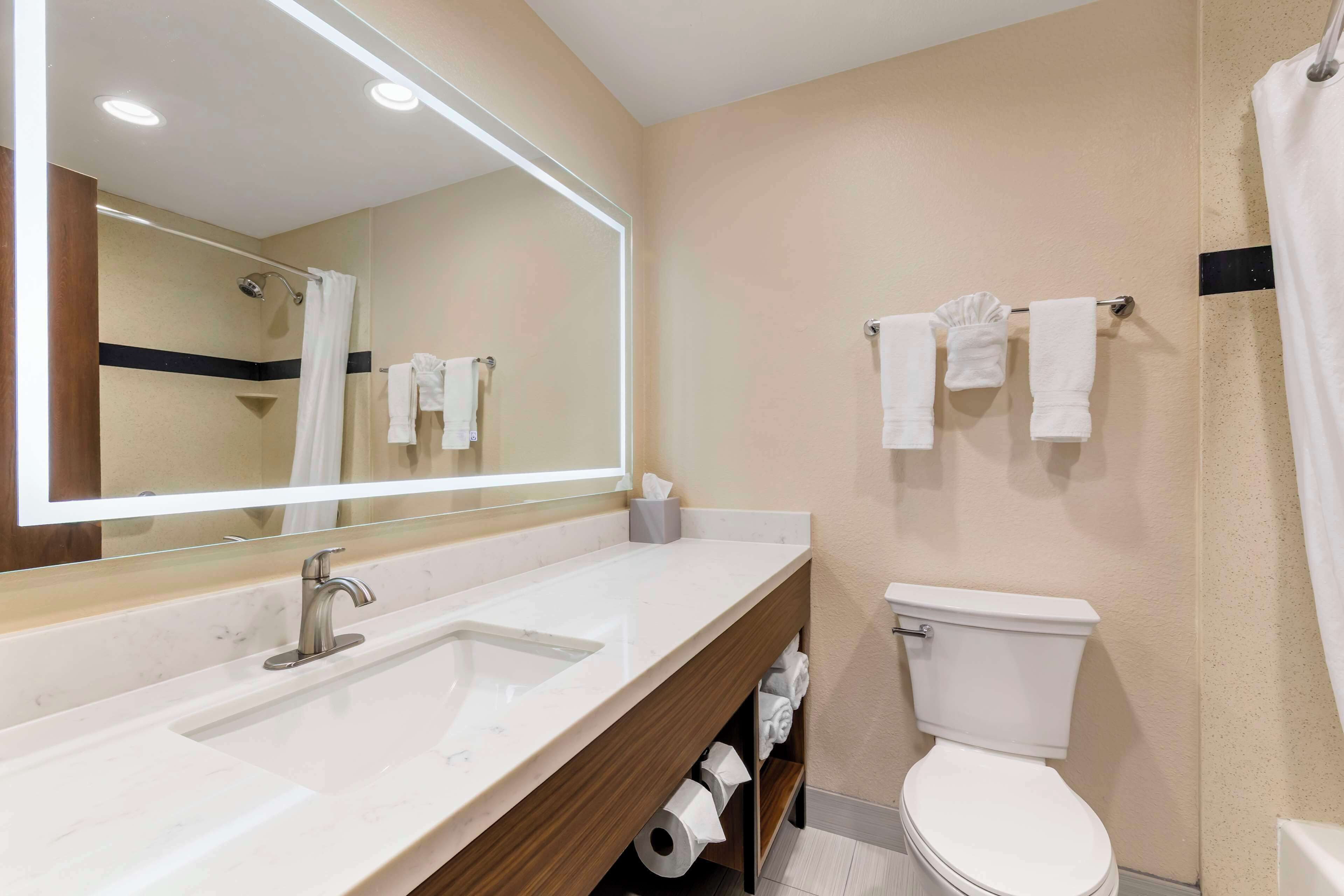 standard room, 2 queen beds, non smoking, refrigerator & microwave | bathroom | combined shower/bathtub, free toiletries, hair dryer, towels