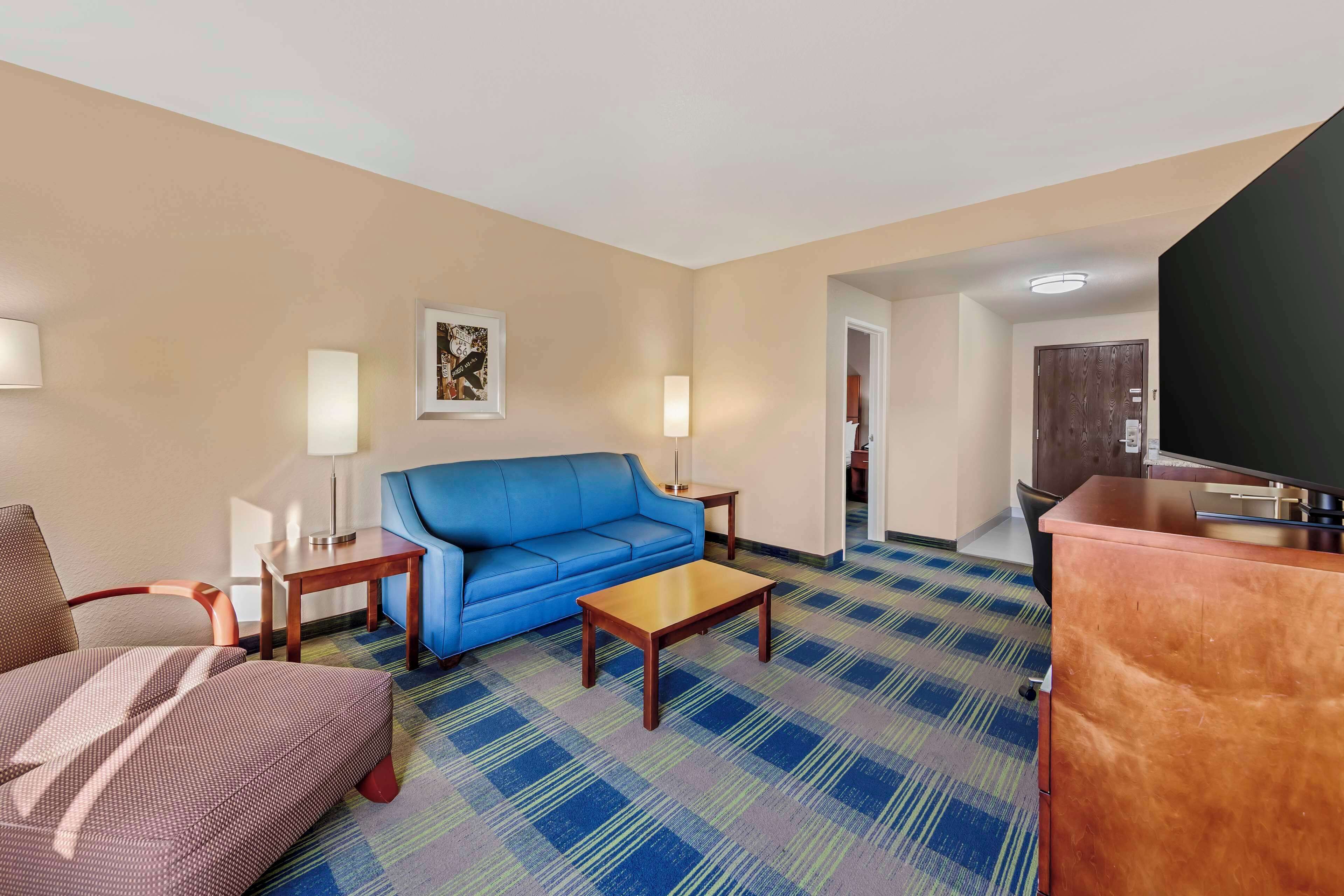 suite, 1 king bed, non smoking, jetted tub (with sofabed) | desk, laptop workspace, blackout curtains, iron/ironing board