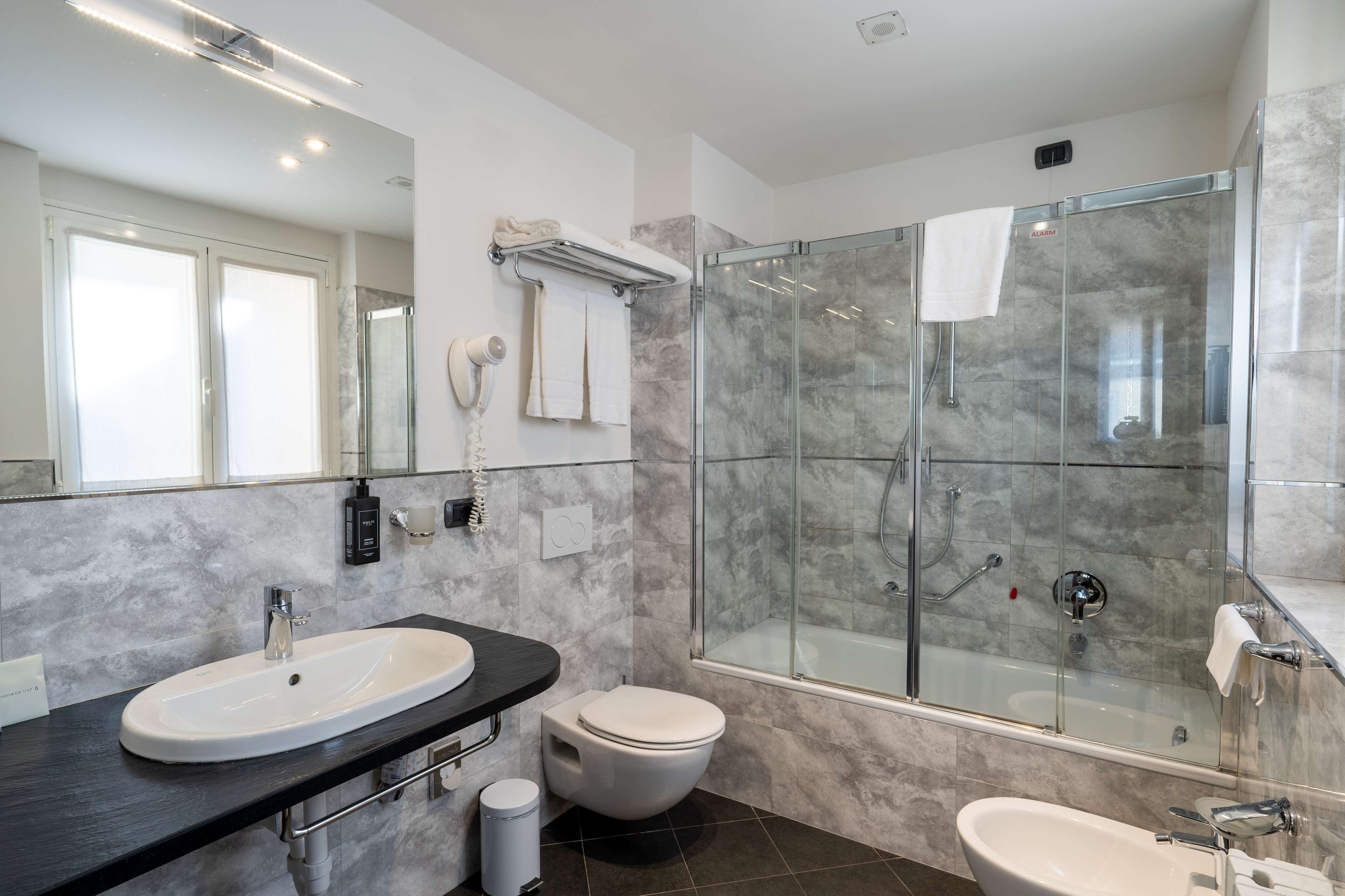 eco-friendly toiletries, hair dryer, bathrobes, slippers