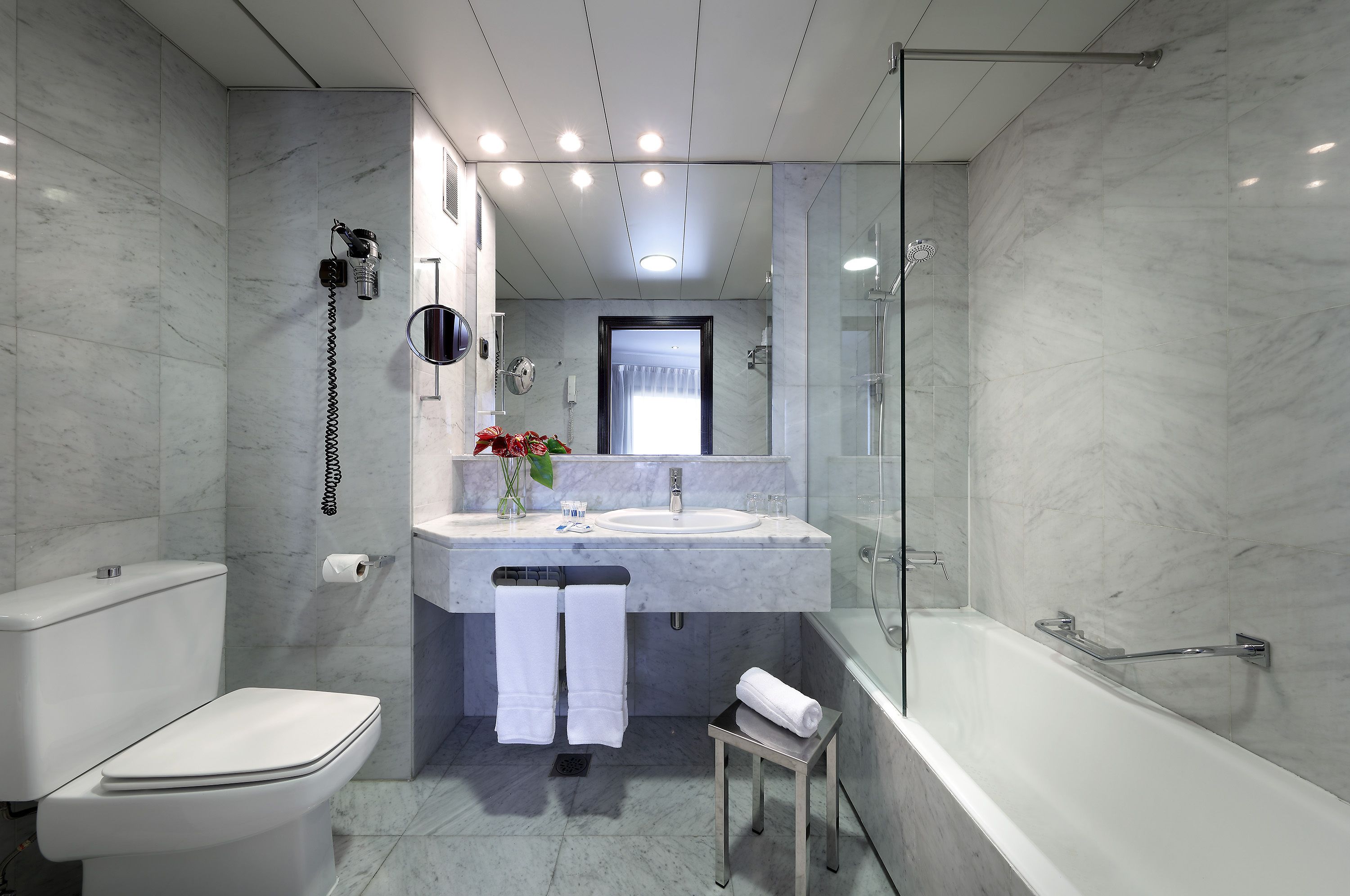 eco-friendly toiletries, hair dryer, towels