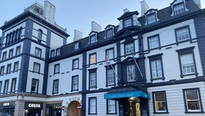 A historic building with a 'Carlisle Station Hotel' sign, a Costa Coffee shop, and a 'No Entry' sign. - Carlisle Station Hotel, Sure Hotel Collection by BW (Carlisle)