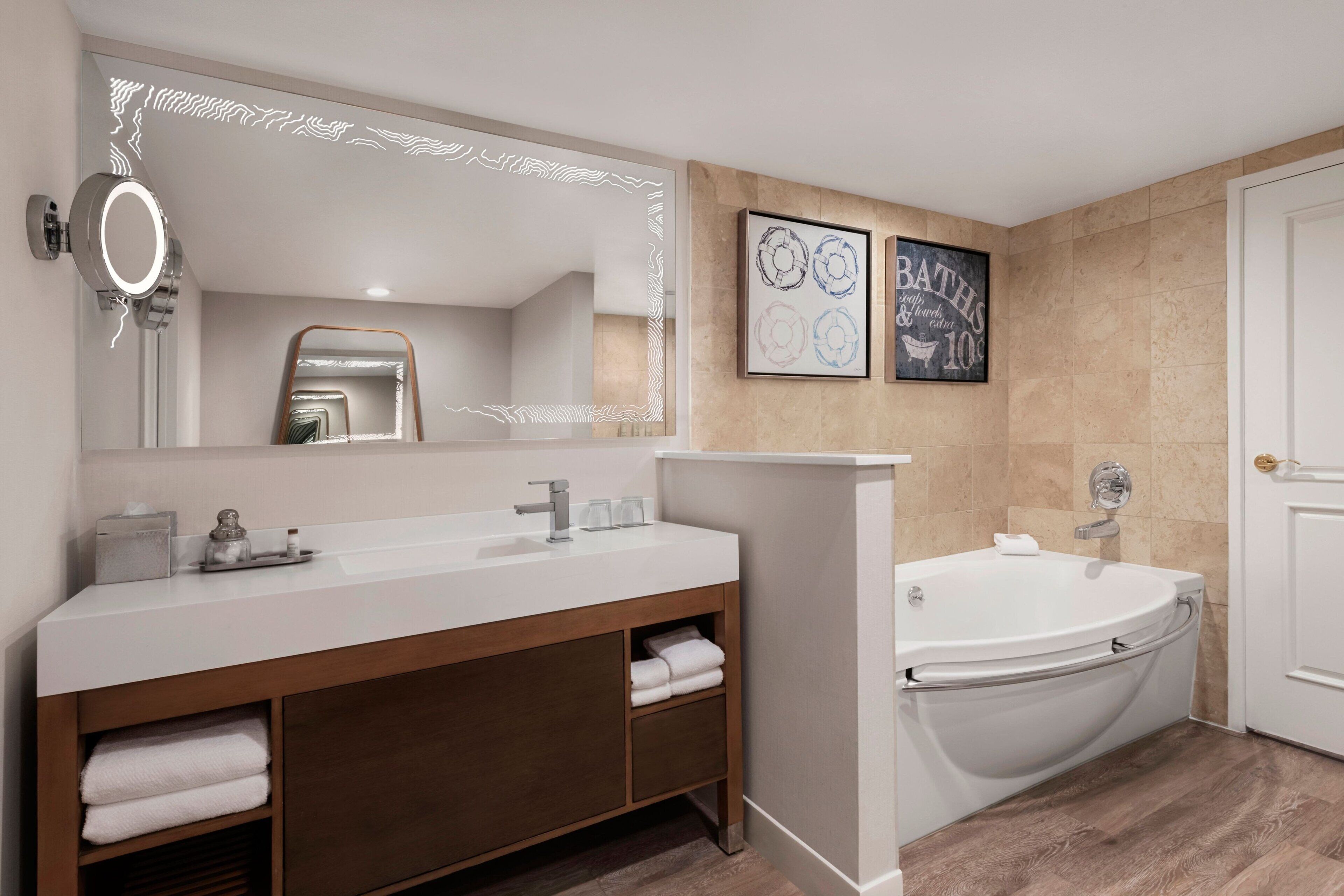 combined shower/bathtub, designer toiletries, hair dryer, bathrobes