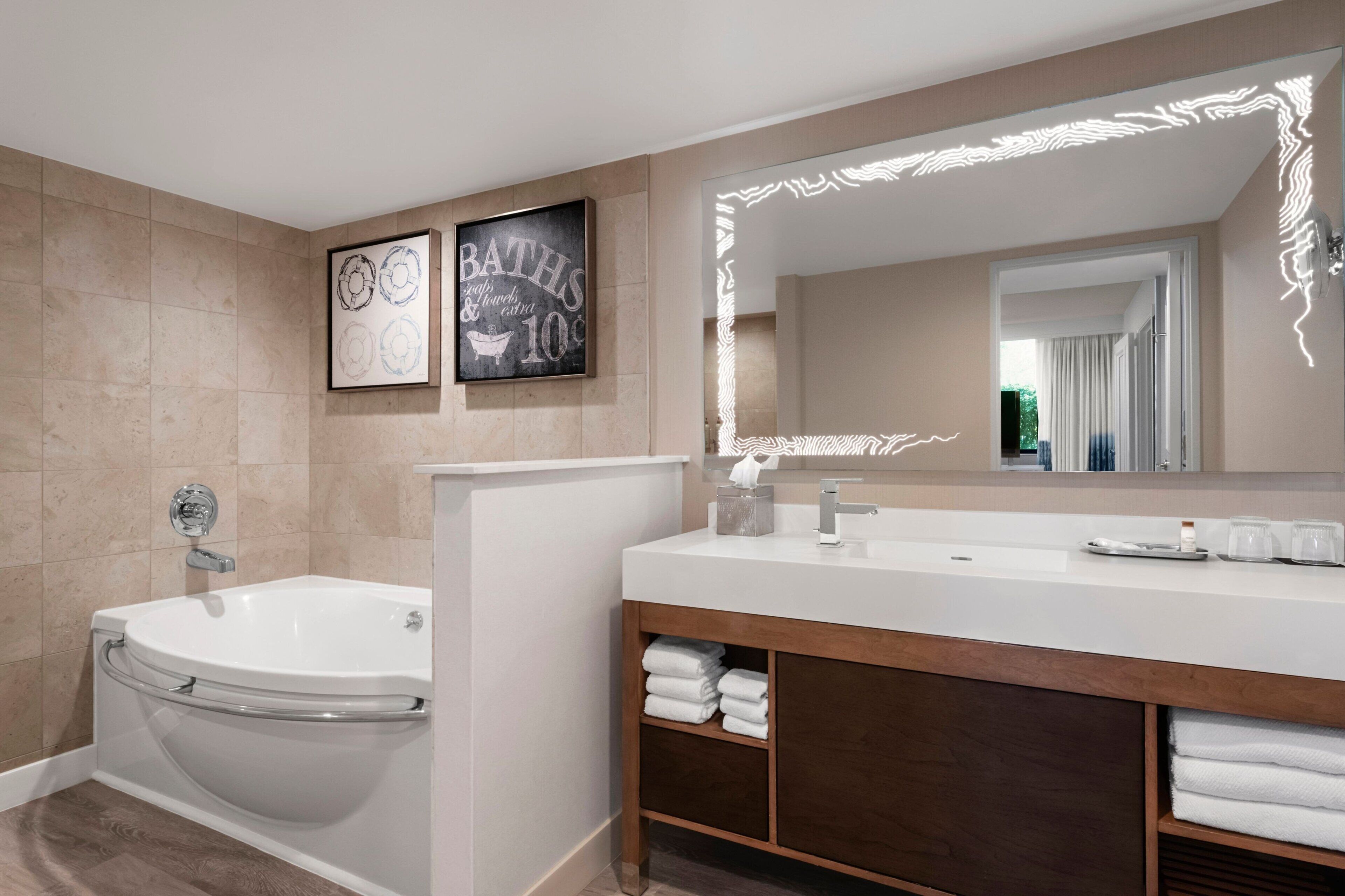 combined shower/bathtub, designer toiletries, hair dryer, bathrobes